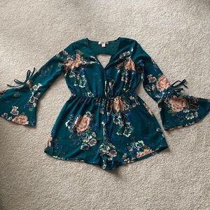 Flower patterned, teal romper, open keyhole back